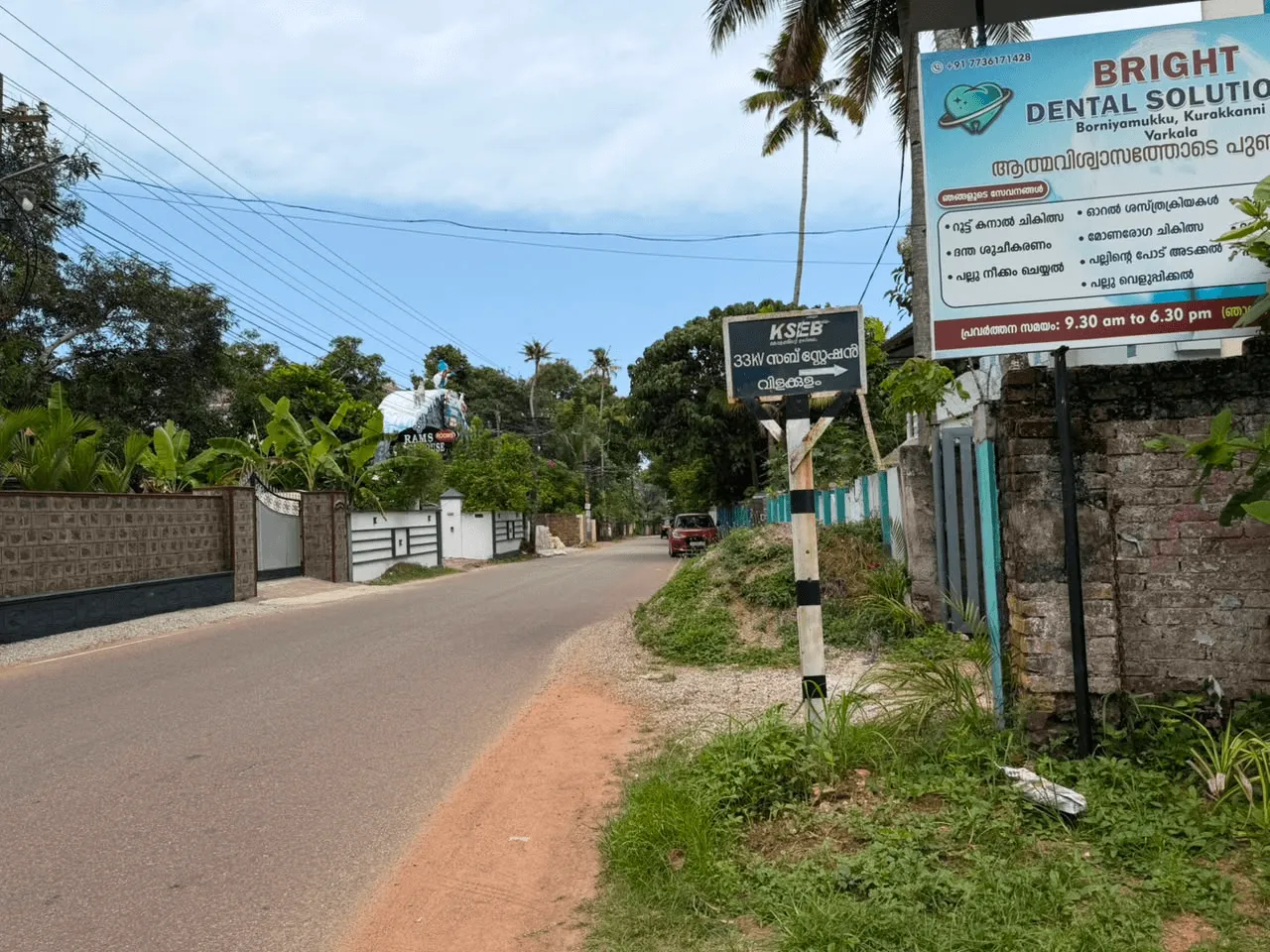 The Bright Dental Solutions information board on the approach road, listing treatments and opening hours